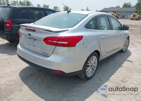 2015 Ford Focus Titanium z USA, uszkodzony, nr VIN 1FADP3J24FL280341